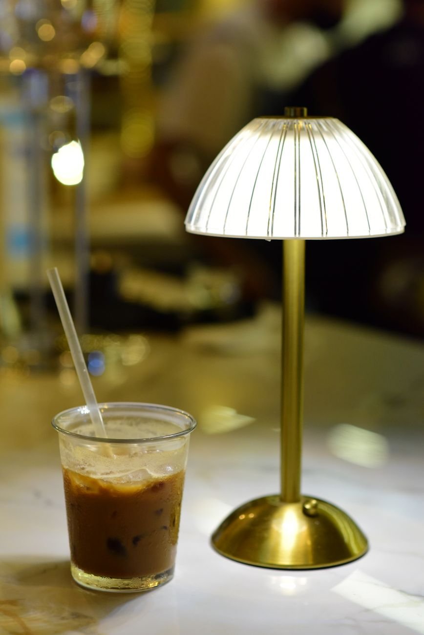 iced coffee with elegant table lamp at night