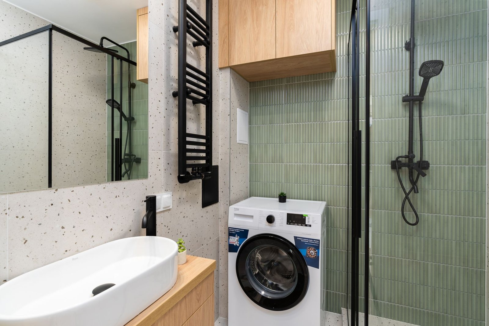modern bathroom laundry area with washer and shower